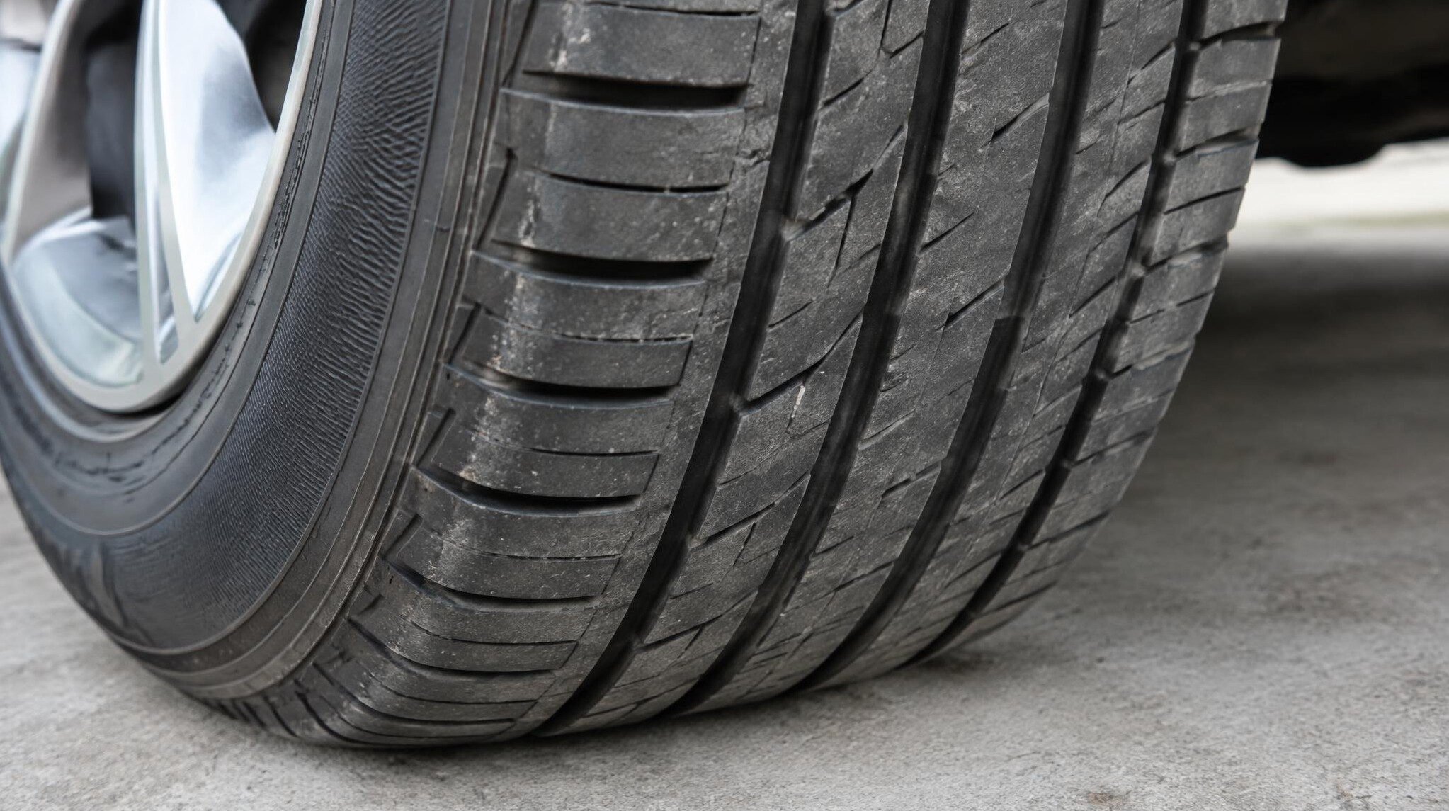 Close view of a car wheel and tire tread